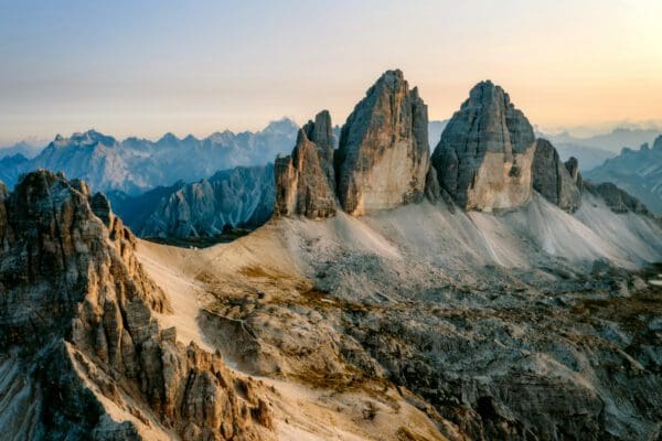 epic aerial view of tre cime di lavaredo during sunset, dolomites, italy